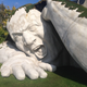 Illustration for article titled Scary giant man crawls out from the ground in shocking outdoor sculpture